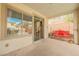 Cozy covered patio offers a relaxing outdoor space with a swing and view of the private backyard at 4208 Lower Saxon Ave, North Las Vegas, NV 89085