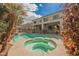 Backyard featuring a private pool and spa, perfect for outdoor relaxation at 4208 Lower Saxon Ave, North Las Vegas, NV 89085