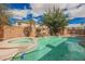 Backyard pool and spa surrounded by lush greenery and patio space at 4208 Lower Saxon Ave, North Las Vegas, NV 89085