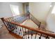 Carpeted staircase featuring decorative iron spindles and wood railing at 4208 Lower Saxon Ave, North Las Vegas, NV 89085