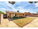 Backyard with covered patio and new grass at 4360 Wendy Ln, Las Vegas, NV 89115