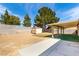 Backyard with shed, covered patio and partial artificial turf at 4360 Wendy Ln, Las Vegas, NV 89115