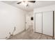 Comfortable bedroom featuring a ceiling fan, neutral carpet, and sliding closet doors for storage at 4360 Wendy Ln, Las Vegas, NV 89115