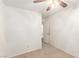 This bedroom has neutral carpet, ceiling fan and a door to a bathroom at 4360 Wendy Ln, Las Vegas, NV 89115