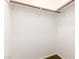 Clean and tidy walk-in closet offering ample storage space with a simple rod and shelf at 4360 Wendy Ln, Las Vegas, NV 89115