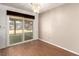 Cozy dining area with laminate flooring and a sliding glass door leading to the backyard at 4360 Wendy Ln, Las Vegas, NV 89115