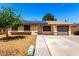 Charming single-story home featuring solar panels, a well-maintained yard, and a convenient attached garage at 4360 Wendy Ln, Las Vegas, NV 89115