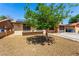 Charming single-story home featuring a lush tree, a low-maintenance yard, and an attached garage at 4360 Wendy Ln, Las Vegas, NV 89115