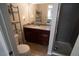 Bathroom featuring granite countertops, updated fixtures, and a glass-enclosed shower at 4411 Alexis Dr # 444, Las Vegas, NV 89103