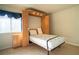 Bedroom showing the opened Murphy bed with lights at 4411 Alexis Dr # 444, Las Vegas, NV 89103