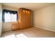 Bright bedroom featuring carpet and a large cabinet with built-in lights at 4411 Alexis Dr # 444, Las Vegas, NV 89103