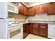 Kitchen with wooden cabinets and granite countertops at 4411 Alexis Dr # 444, Las Vegas, NV 89103