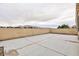 Large backyard with block wall fencing and mountain views in the distance at 5166 Silverheart Ave, Las Vegas, NV 89142
