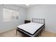 Bedroom featuring a bed, dresser, and large window providing natural light at 5166 Silverheart Ave, Las Vegas, NV 89142