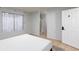 View from a bedroom with tiled floors towards the window, bathroom and bedroom door at 5166 Silverheart Ave, Las Vegas, NV 89142