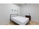 Bedroom with a bed and dresser featuring neutral walls and tile flooring at 5166 Silverheart Ave, Las Vegas, NV 89142