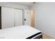 Bedroom featuring bed, sliding door closet, and neutral colored walls at 5166 Silverheart Ave, Las Vegas, NV 89142