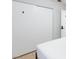 Bedroom with a large sliding door closet, light tile and simple furnishings at 5166 Silverheart Ave, Las Vegas, NV 89142