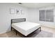 Bedroom featuring a large window, tile flooring, simple furnishings and wall decor at 5166 Silverheart Ave, Las Vegas, NV 89142
