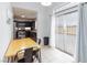 Dining area adjacent to the kitchen with sliding glass door to the backyard at 5166 Silverheart Ave, Las Vegas, NV 89142