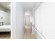 Hallway with tile floors connecting bedroom with bed and decorative fireplace at 5166 Silverheart Ave, Las Vegas, NV 89142