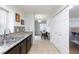 Bright kitchen showcasing stainless steel appliances, granite countertops, and a dining area at 5166 Silverheart Ave, Las Vegas, NV 89142
