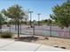 View of community basketball court with lighting and trees at 5236 Sunstone Mesa Dr, Las Vegas, NV 89166