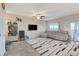 Inviting living room with neutral decor, plush seating, and an access door to backyard at 5236 Sunstone Mesa Dr, Las Vegas, NV 89166