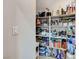 Walk in pantry features custom shelving at 5236 Sunstone Mesa Dr, Las Vegas, NV 89166