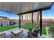 Outdoor patio with seating area, artificial grass, and mountain views at 5236 Sunstone Mesa Dr, Las Vegas, NV 89166