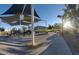 Community playground with sunshade, slides, and walking path at 5236 Sunstone Mesa Dr, Las Vegas, NV 89166