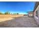Expansive backyard with a brick wall, offering privacy and space for landscaping at 5846 Slate Rock Ct, Las Vegas, NV 89149