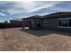 Spacious backyard featuring a covered patio, perfect for relaxation and outdoor gatherings at 5846 Slate Rock Ct, Las Vegas, NV 89149
