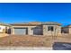 Charming single-story home with a three-car garage and beautiful brick driveway at 5846 Slate Rock Ct, Las Vegas, NV 89149