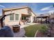 Spacious backyard with a covered patio, gazebo, and cozy furniture at 609 Viale Machiavelli Ln, Henderson, NV 89011