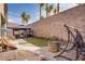 Serene backyard with a brick wall, gazebo, and a hanging swing at 609 Viale Machiavelli Ln, Henderson, NV 89011