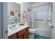 Bathroom features a shower and tub combination with a stylish vanity and neutral color palette at 609 Viale Machiavelli Ln, Henderson, NV 89011