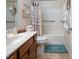 Bathroom features a shower and tub combination with a stylish vanity and neutral color palette at 609 Viale Machiavelli Ln, Henderson, NV 89011