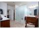 Bathroom with dual vanities, walk-in shower, and tile flooring at 609 Viale Machiavelli Ln, Henderson, NV 89011