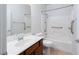 Bathroom with grab bars, a sink, a toilet, and a shower and tub combination at 609 Viale Machiavelli Ln, Henderson, NV 89011