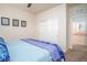 Bright bedroom with blue accents features a double door closet and leads to another room at 609 Viale Machiavelli Ln, Henderson, NV 89011