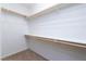 Walk-in closet with wooden racks and shelving at 609 Viale Machiavelli Ln, Henderson, NV 89011