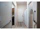 Hallway that offers access to laundry, the main home, and features grab bars for accessibility at 609 Viale Machiavelli Ln, Henderson, NV 89011