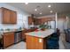 Spacious kitchen features granite counters, stainless appliances, and breakfast bar at 609 Viale Machiavelli Ln, Henderson, NV 89011