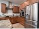 Bright kitchen boasts stainless steel appliances and granite countertops at 609 Viale Machiavelli Ln, Henderson, NV 89011
