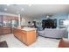 Modern kitchen with a large island, stainless steel appliances, and a seamless connection to the living area at 609 Viale Machiavelli Ln, Henderson, NV 89011