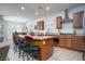 Open kitchen showcases a functional island with seating, stainless steel appliances, and ample counter space at 609 Viale Machiavelli Ln, Henderson, NV 89011