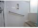 Walk-in shower featuring grab bar, bench seat, and soap dish at 609 Viale Machiavelli Ln, Henderson, NV 89011