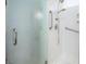 Modern bathroom shower with glass door, and handheld shower head at 609 Viale Machiavelli Ln, Henderson, NV 89011