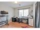 Bedroom with a modern desk and laminate wood flooring and a window at 6891 Nickel Mine Ave, Las Vegas, NV 89122